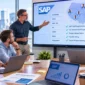Diverse corporate team in a modern boardroom discussing SAP staff augmentation shown on a screen.