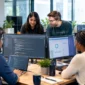 Software developers collaborating on coding, application development, and technology projects in a modern office.